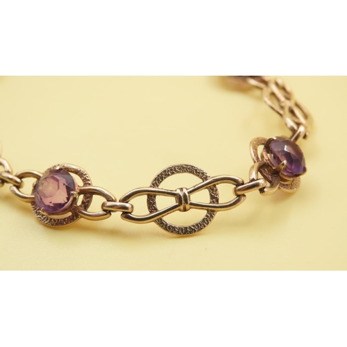 579 - Fancy Link Amethyst Set Bracelet Mounted in 9 Carat Yellow Gold at 19cm Long