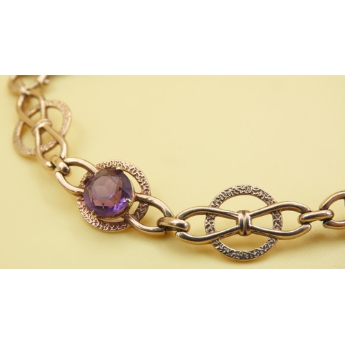 579 - Fancy Link Amethyst Set Bracelet Mounted in 9 Carat Yellow Gold at 19cm Long