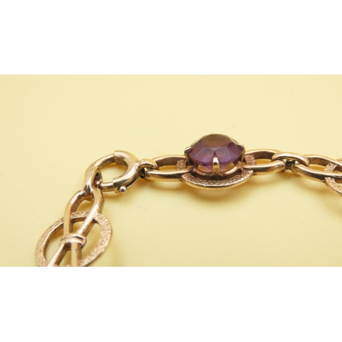 579 - Fancy Link Amethyst Set Bracelet Mounted in 9 Carat Yellow Gold at 19cm Long