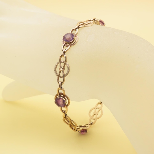 579 - Fancy Link Amethyst Set Bracelet Mounted in 9 Carat Yellow Gold at 19cm Long