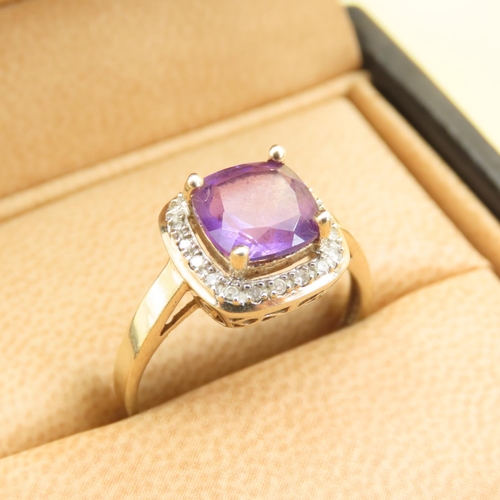 580 - Cushion Cut Amethyst and Diamond Halo Ring Mounted on 9 Carat Yellow Gold Band Size Q