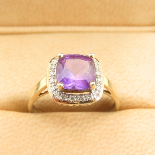 580 - Cushion Cut Amethyst and Diamond Halo Ring Mounted on 9 Carat Yellow Gold Band Size Q