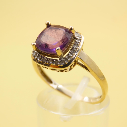 580 - Cushion Cut Amethyst and Diamond Halo Ring Mounted on 9 Carat Yellow Gold Band Size Q