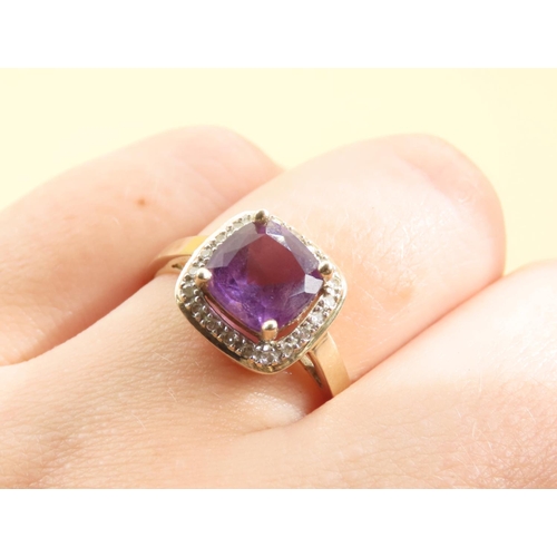 580 - Cushion Cut Amethyst and Diamond Halo Ring Mounted on 9 Carat Yellow Gold Band Size Q