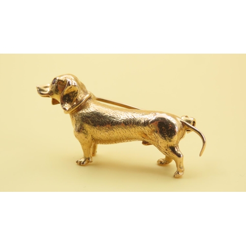 581 - Dachshund Motif 9 Carat Yellow Gold Brooch With Ruby Inset Eye Detailing 4cm Wide