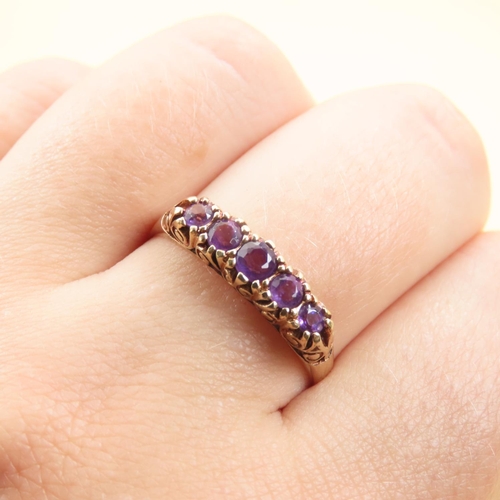 582 - Five Stone Amethyst Set Ring Mounted on 9 Carat Yellow Gold Band Size U