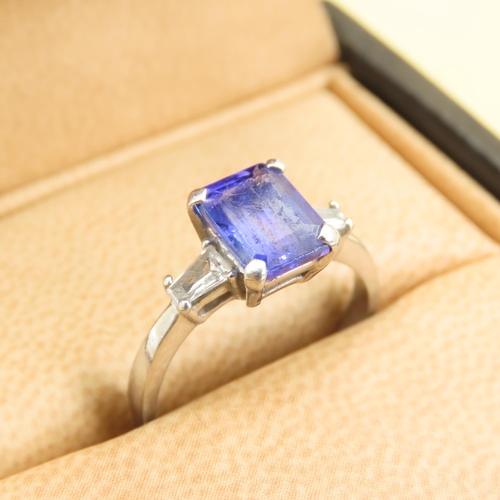 585 - Tanzanite Center Stone and Baguette Cut Diamond Ring Mounted on 18 Carat White Gold Band Size L