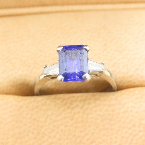 585 - Tanzanite Center Stone and Baguette Cut Diamond Ring Mounted on 18 Carat White Gold Band Size L