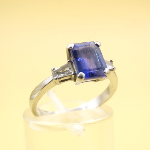 585 - Tanzanite Center Stone and Baguette Cut Diamond Ring Mounted on 18 Carat White Gold Band Size L