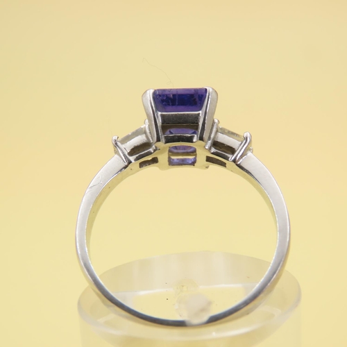 585 - Tanzanite Center Stone and Baguette Cut Diamond Ring Mounted on 18 Carat White Gold Band Size L