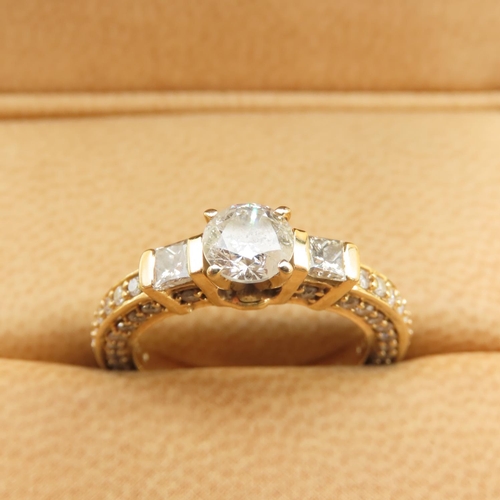 597 - Three Stone Diamond Ring With Further Inset Diamonds to Band Mounted in 18 Carat Yellow Gold Band Si... 