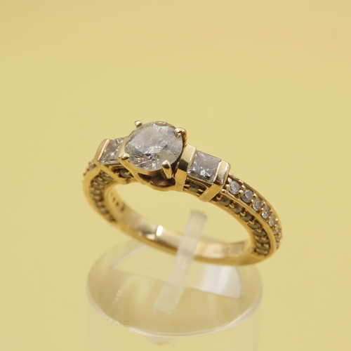 597 - Three Stone Diamond Ring With Further Inset Diamonds to Band Mounted in 18 Carat Yellow Gold Band Si... 