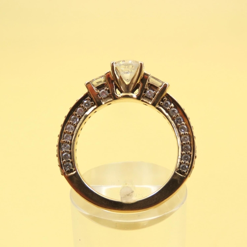 597 - Three Stone Diamond Ring With Further Inset Diamonds to Band Mounted in 18 Carat Yellow Gold Band Si... 