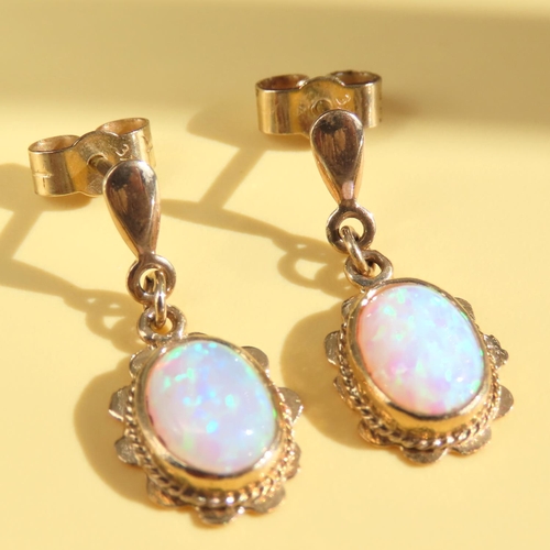 61 - Pair of Opal Drop Earrings Mounted on 9 Carat Yellow Gold Each 2cm Drop