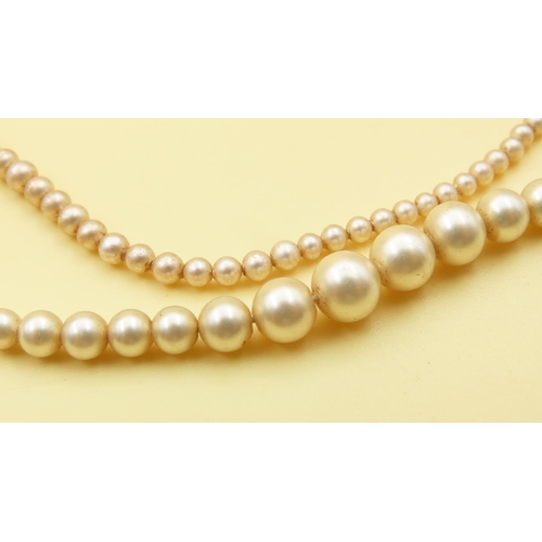 656 - Two Pairs of Graduated Form Pearl Necklaces