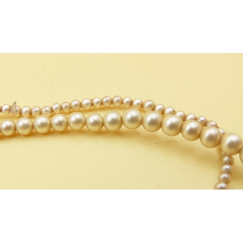 656 - Two Pairs of Graduated Form Pearl Necklaces