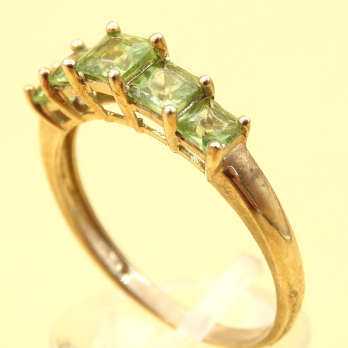 74 - Five Stone Princess Cut Peridot Ring Mounted on 9 Carat Yellow Gold Band Ring Size V and a Half