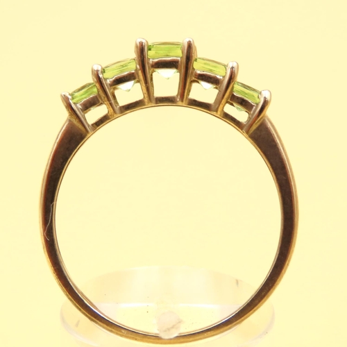 74 - Five Stone Princess Cut Peridot Ring Mounted on 9 Carat Yellow Gold Band Ring Size V and a Half