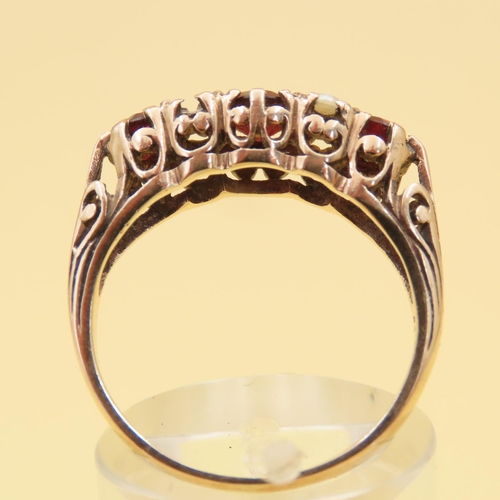 84 - Three Stone Red Garnet and Seed Pearl Ring Mounted on 9 Carat Yellow Gold Band Size P
