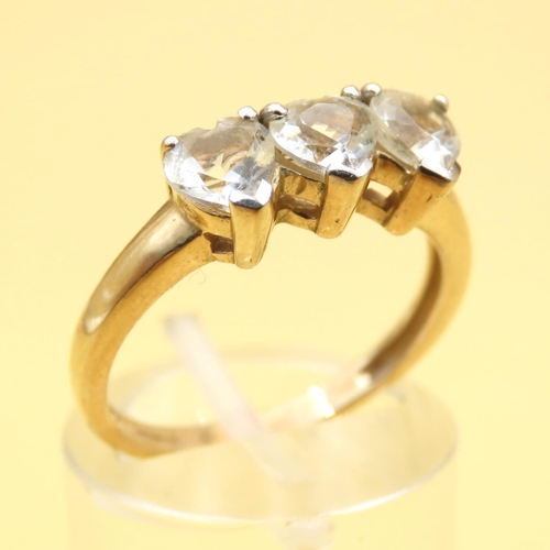 96 - Three Stone White Topaz Heart Cut Ring Mounted on 9 Carat Yellow Gold Band Ring Size N