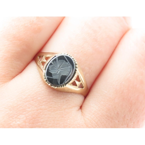 1015 - Panel Set Hematite Signet Ring Mounted on 9 Carat Yellow Gold Band Ring Size T