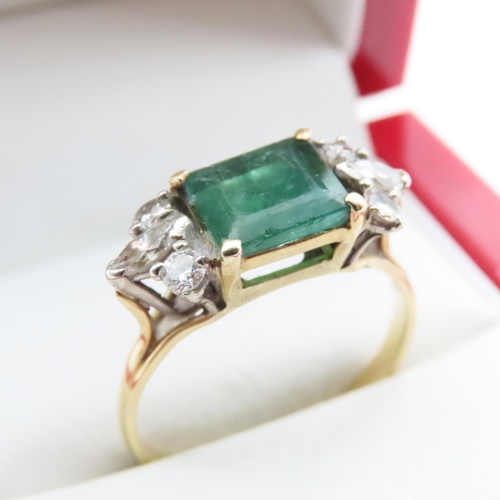 1058 - Emerald And Diamond Ring Attractively Detailed Mounted in 18 Yellow Gold Ring Size V