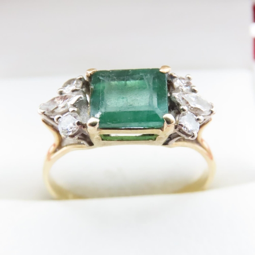 1058 - Emerald And Diamond Ring Attractively Detailed Mounted in 18 Yellow Gold Ring Size V