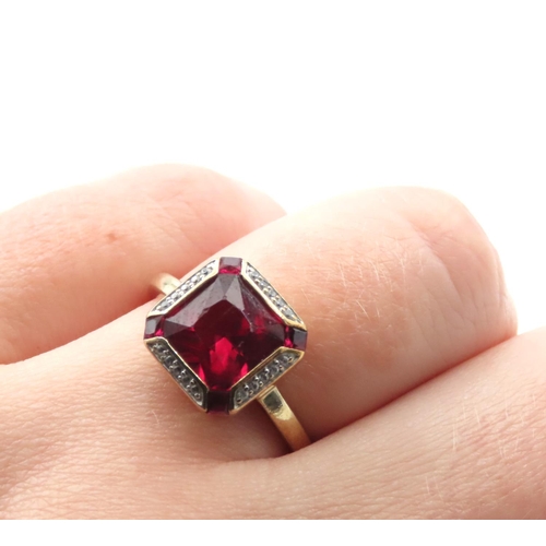 1091 - Red Spinel and Diamond set Ring Mounted on 9 Carat Yellow Gold Ring Size O