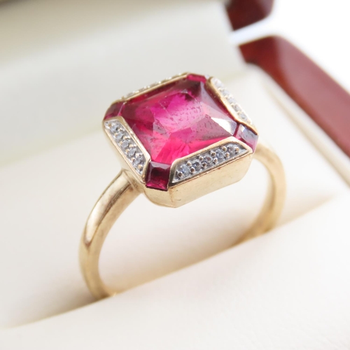 1091 - Red Spinel and Diamond set Ring Mounted on 9 Carat Yellow Gold Ring Size O