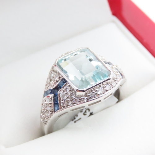 1202 - Emerald Cut Aquamarine, Diamond and Sapphire Cluster Ring Mounted in Platinum Ring Size N