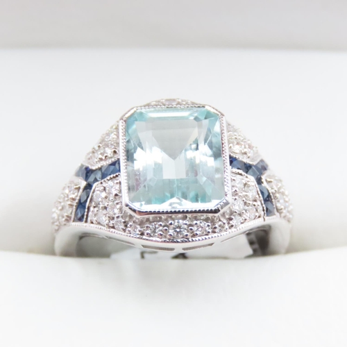 1202 - Emerald Cut Aquamarine, Diamond and Sapphire Cluster Ring Mounted in Platinum Ring Size N