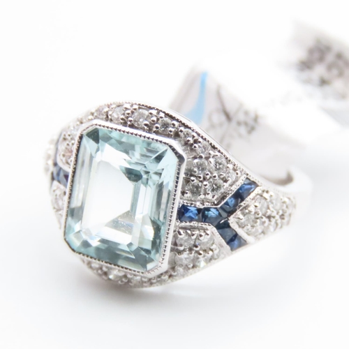 1202 - Emerald Cut Aquamarine, Diamond and Sapphire Cluster Ring Mounted in Platinum Ring Size N