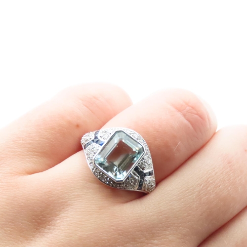 1202 - Emerald Cut Aquamarine, Diamond and Sapphire Cluster Ring Mounted in Platinum Ring Size N