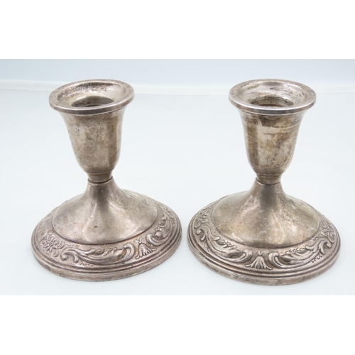 122 - Pair of Silver Pedestal Form Candle Rests Embossed Decoration