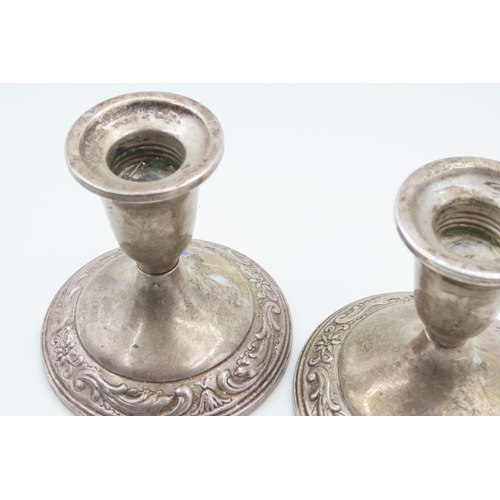 122 - Pair of Silver Pedestal Form Candle Rests Embossed Decoration