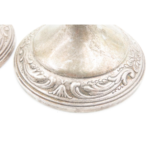 122 - Pair of Silver Pedestal Form Candle Rests Embossed Decoration