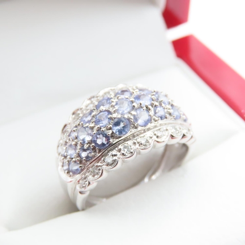 1226 - Pale Tanzanite and Diamond Set Cluster Ring Mounted in 9 Carat White Gold Ring Size L