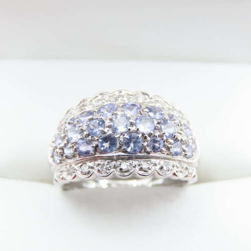 1226 - Pale Tanzanite and Diamond Set Cluster Ring Mounted in 9 Carat White Gold Ring Size L