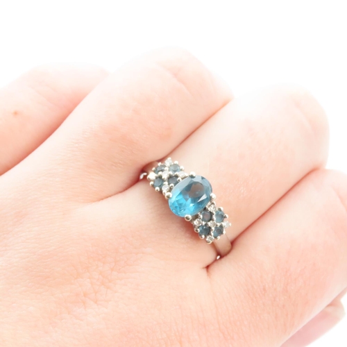 1240 - Blue Topaz Ladies Cluster Ring Mounted in 9 Carat White Gold Ring Size S and a Half