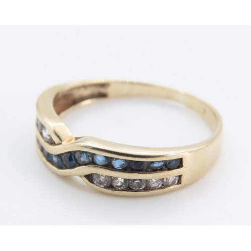 1243 - Sapphire and Gemstone Crossover Ring Mounted in 9 Carat Yellow Gold Band Ring Size M and a Half