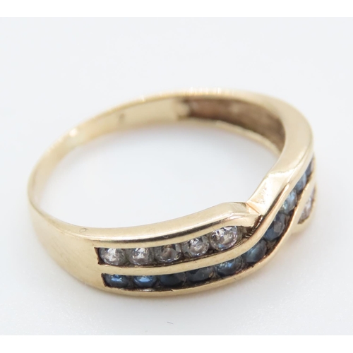 1243 - Sapphire and Gemstone Crossover Ring Mounted in 9 Carat Yellow Gold Band Ring Size M and a Half