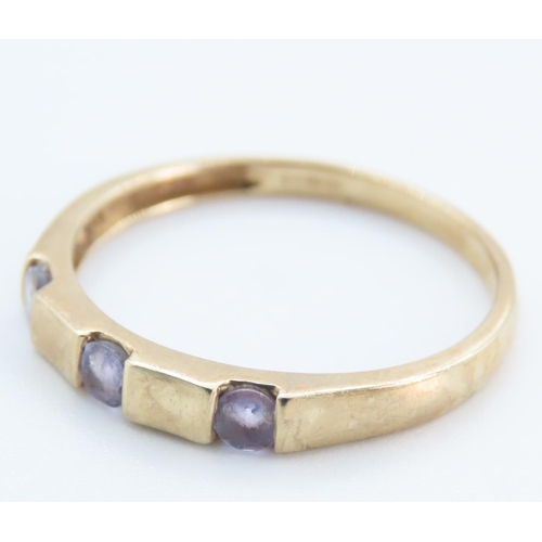 1253 - Three Stone Amethyst Ring set in 9 Carat Yellow Gold Band Ring Size T and a Half