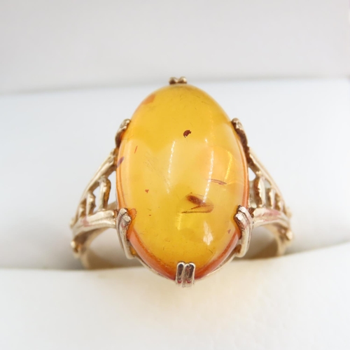 1256 - Basket Set Amber Statement Ring Mounted on 9 Carat Yellow Gold Ring Size R and a Half