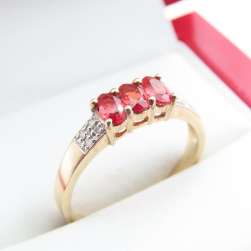 1356 - Three Stone Red Garnet and Diamond Set Ring Mounted in 9 Carat Yellow Gold Ring Size Q and a Half