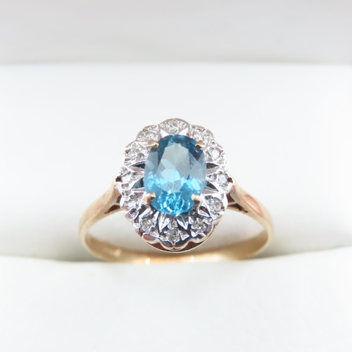 1368 - Blue Topaz and Diamond Ladies Cluster Ring Mounted in 9 Carat Yellow Gold Ring Size N and a Half