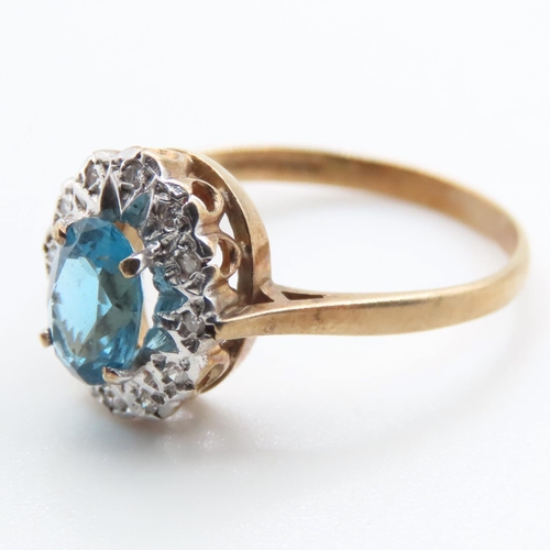 1368 - Blue Topaz and Diamond Ladies Cluster Ring Mounted in 9 Carat Yellow Gold Ring Size N and a Half