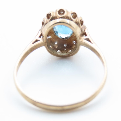 1368 - Blue Topaz and Diamond Ladies Cluster Ring Mounted in 9 Carat Yellow Gold Ring Size N and a Half