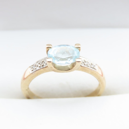 1372 - Aquamarine Solitaire Ring with Further Diamonds Set to Shoulder Mounted in 9 Carat Yellow Gold Ring ... 