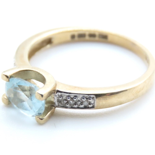 1372 - Aquamarine Solitaire Ring with Further Diamonds Set to Shoulder Mounted in 9 Carat Yellow Gold Ring ... 