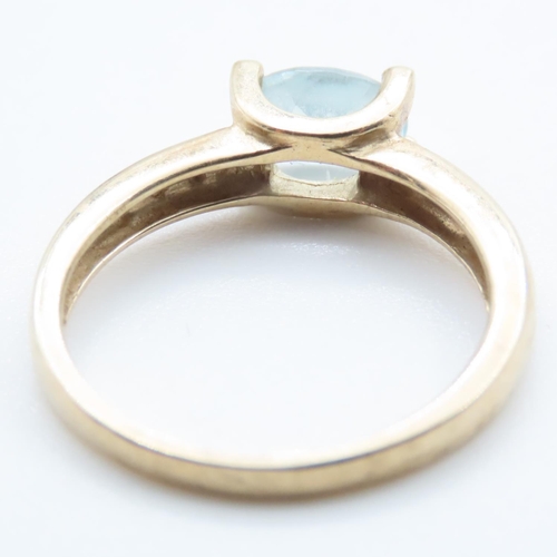 1372 - Aquamarine Solitaire Ring with Further Diamonds Set to Shoulder Mounted in 9 Carat Yellow Gold Ring ... 